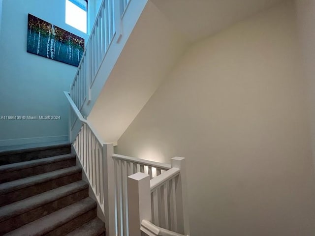 bedroom with light carpet and a textured ceiling