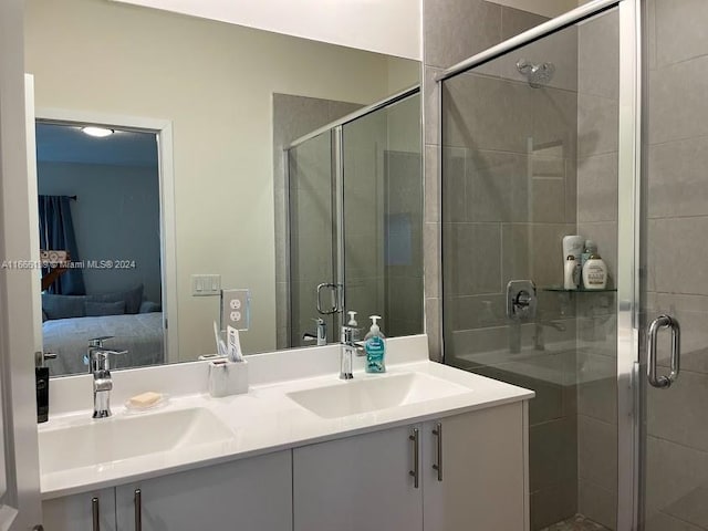 bathroom featuring walk in shower, vanity, and tile patterned floors