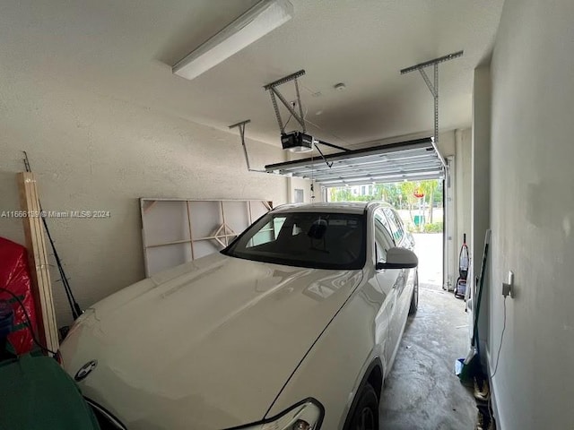 garage featuring a garage door opener