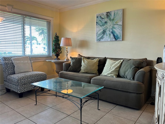 living room featuring ornamental molding and light tile patterned flooring