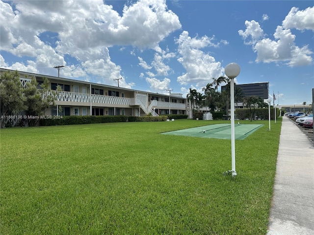 view of home's community with a lawn