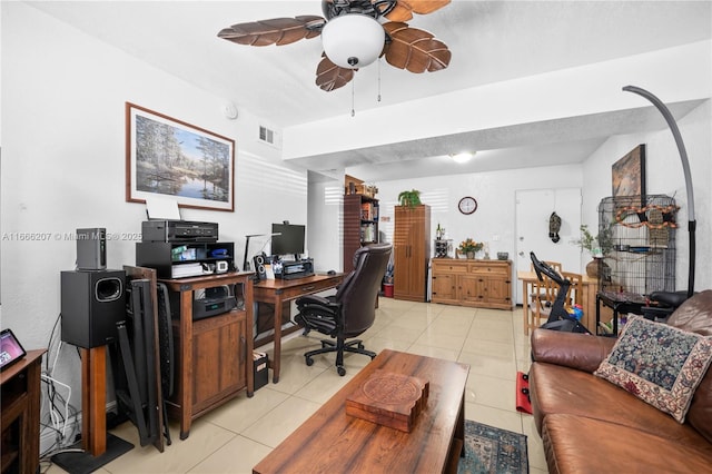 office space with light tile patterned floors, visible vents, and ceiling fan