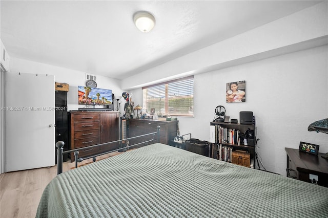 bedroom with light hardwood / wood-style floors