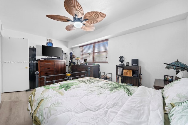 bedroom featuring light wood-type flooring and ceiling fan