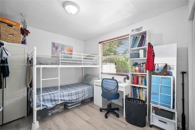 bedroom featuring hardwood / wood-style floors