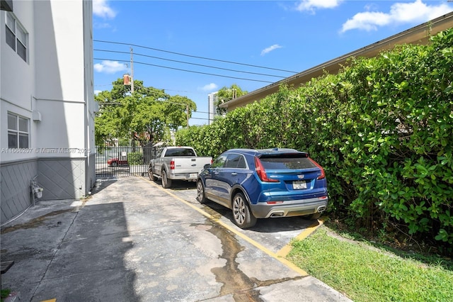 uncovered parking lot with fence