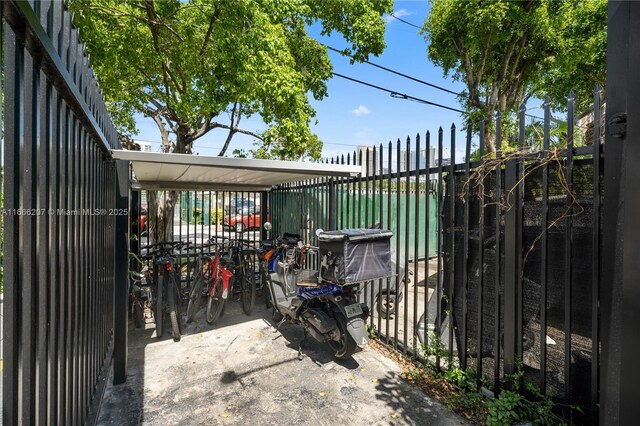 view of gate with a patio area