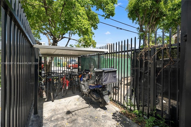 view of gate with fence