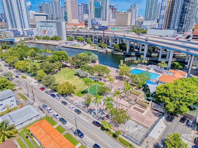 birds eye view of property featuring a city view and a water view