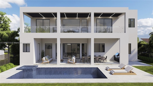 back of house featuring a balcony and a patio