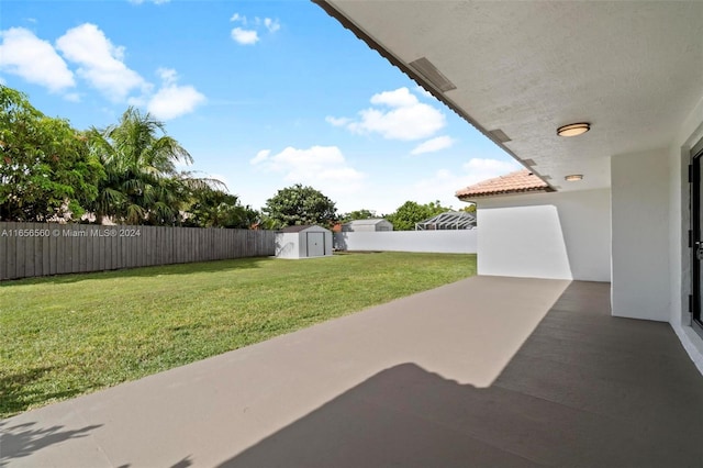 view of patio / terrace with a storage unit