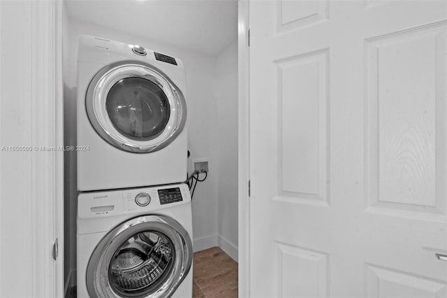 washroom with stacked washer and clothes dryer