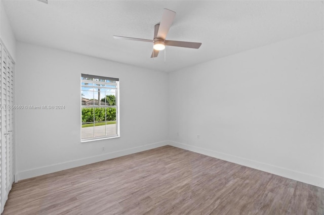 unfurnished room featuring ceiling fan and light hardwood / wood-style floors