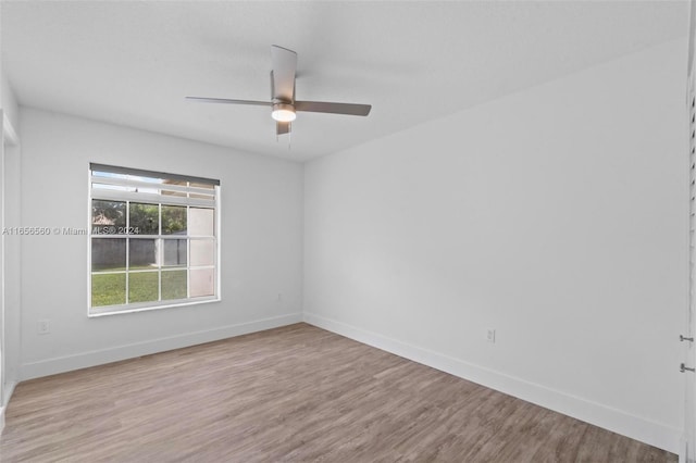 empty room with light wood-type flooring and ceiling fan