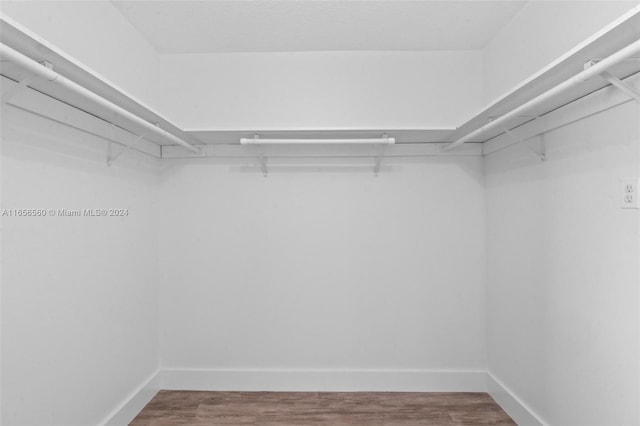 walk in closet featuring hardwood / wood-style floors