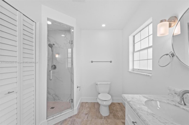 bathroom with walk in shower, tile patterned flooring, vanity, and toilet