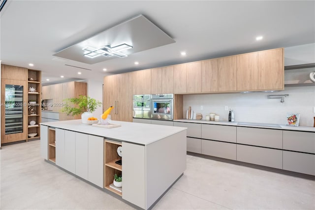 kitchen featuring tasteful backsplash, a center island, double oven, black electric stovetop, and white cabinets