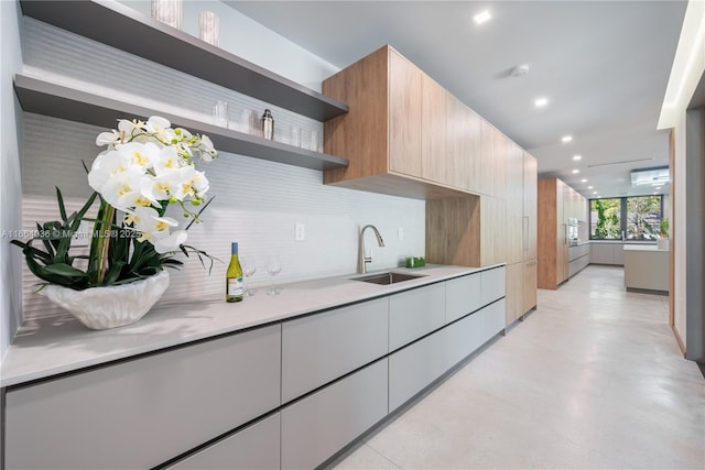 kitchen featuring sink and backsplash