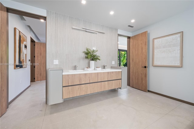 bathroom featuring vanity and concrete floors