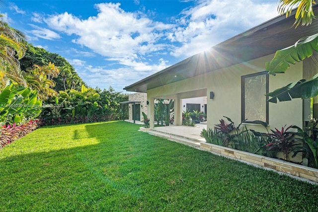 view of yard with a patio area