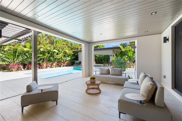 view of patio with outdoor lounge area and a pergola