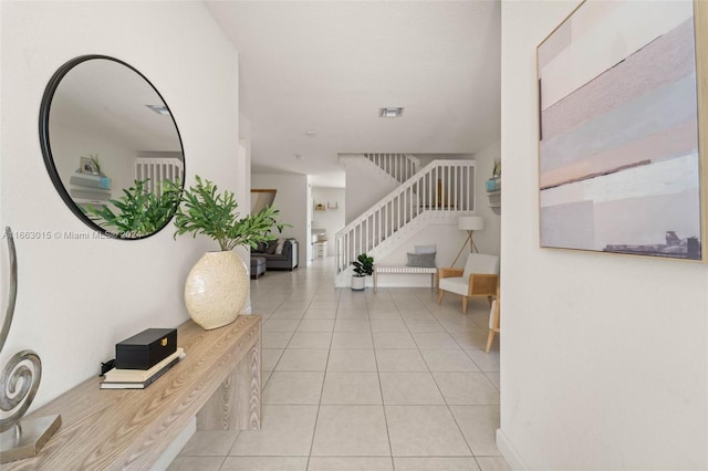 foyer entrance featuring light tile patterned flooring