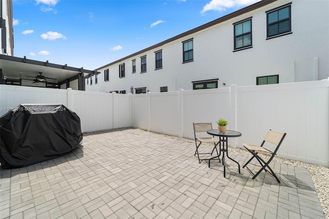 view of patio with grilling area and ceiling fan