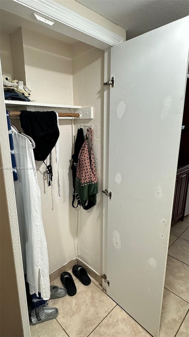 mudroom with light tile patterned floors