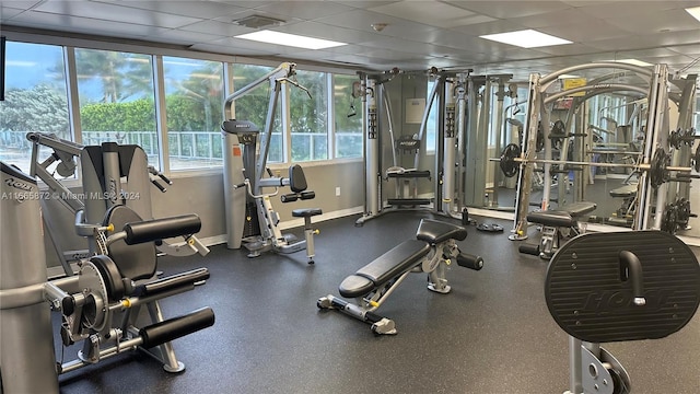 workout area featuring a paneled ceiling