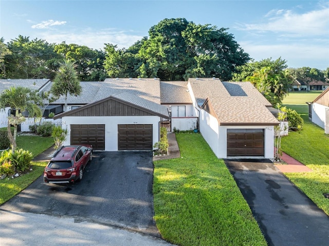 view of front facade with a front lawn and a garage