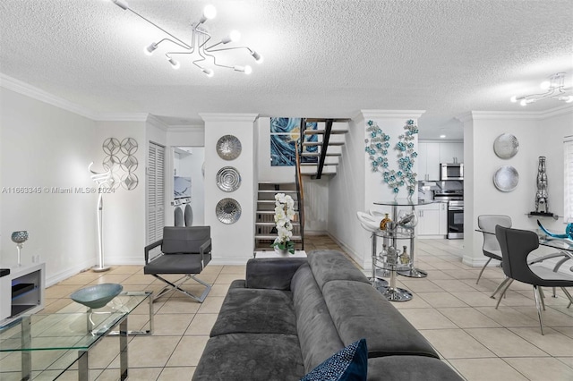 living room featuring a chandelier, a textured ceiling, light tile patterned floors, and ornamental molding