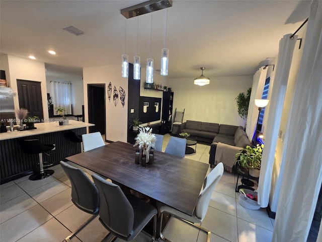 dining space with light tile patterned flooring