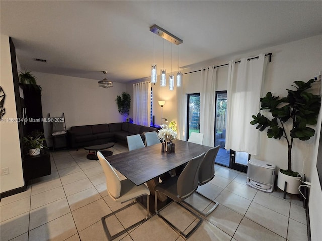 dining room with light tile patterned flooring