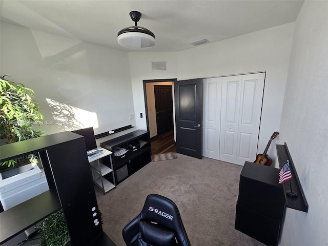 miscellaneous room featuring dark carpet