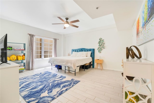 bedroom featuring light hardwood / wood-style floors and ceiling fan