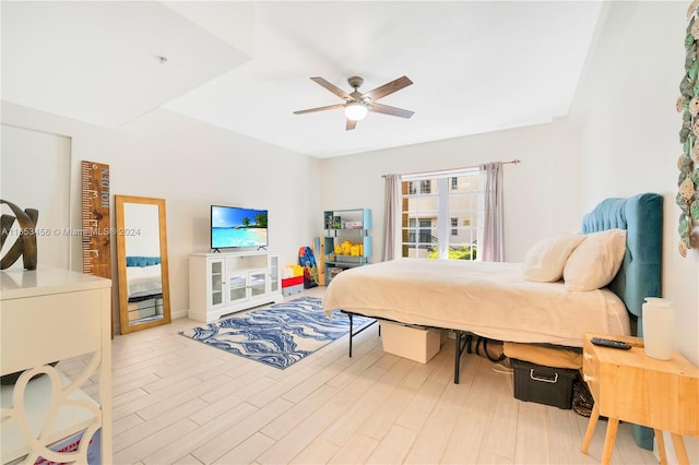 bedroom featuring light wood-type flooring and ceiling fan