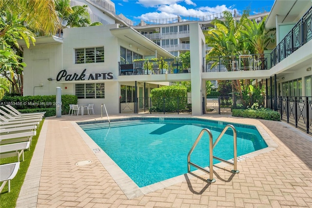 view of swimming pool featuring a patio area