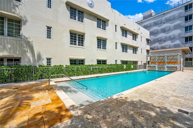 view of swimming pool with a patio