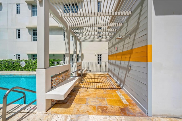 interior space featuring a pergola and a fenced in pool