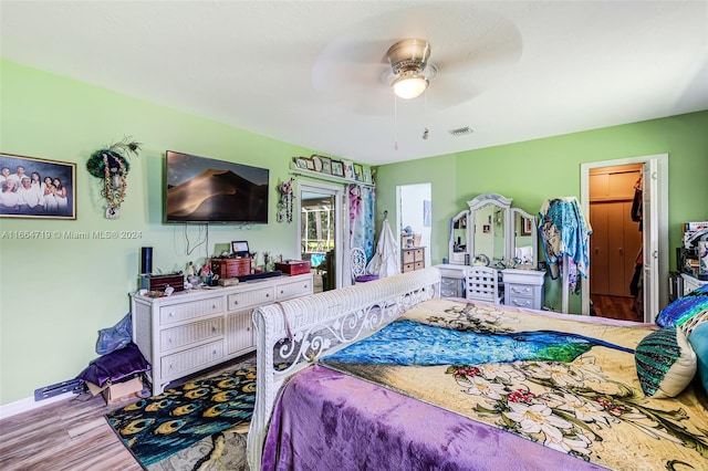 bedroom featuring ceiling fan and light wood-type flooring