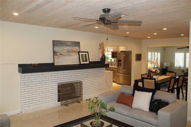 carpeted living room featuring a fireplace, ceiling fan, and wood ceiling