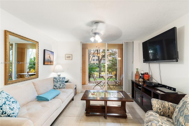 living room with ceiling fan and light tile patterned floors