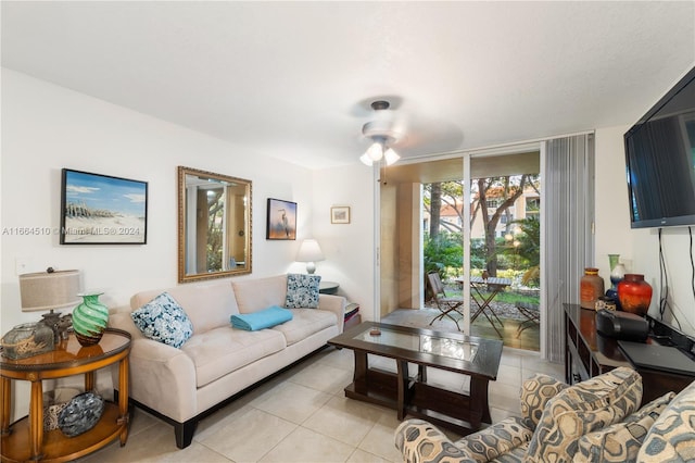 tiled living room with ceiling fan