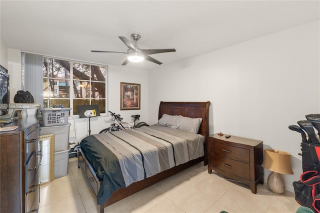 bedroom featuring ceiling fan and light tile patterned flooring