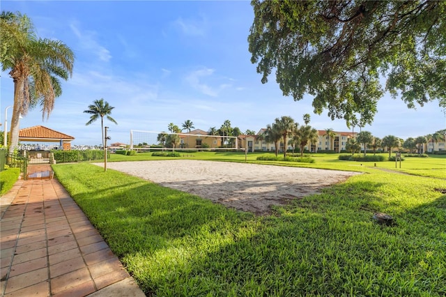 view of property's community with a lawn, volleyball court, and a gazebo