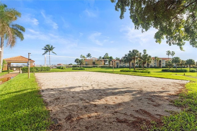 surrounding community with a yard, a gazebo, and volleyball court