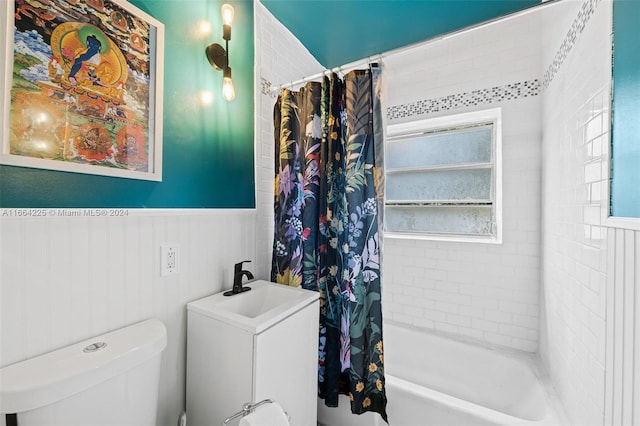 full bathroom featuring shower / bath combo with shower curtain, vanity, and toilet