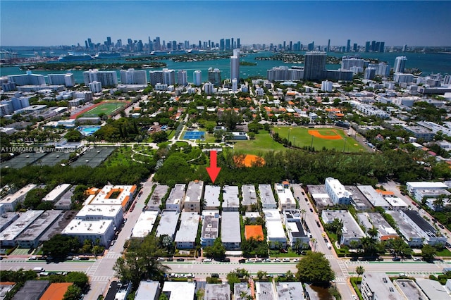 birds eye view of property featuring a water view