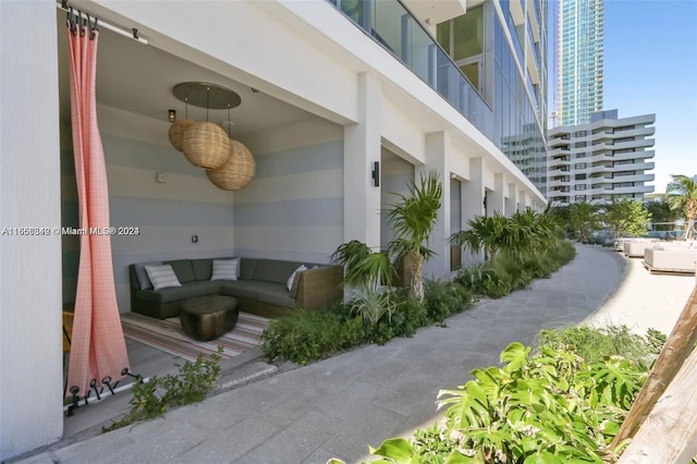 exterior space featuring ceiling fan and an outdoor hangout area