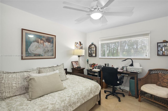 tiled bedroom featuring ceiling fan